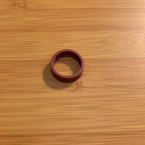 Qalo rose red/rust colored ring. Worn once. Size 7